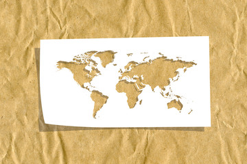 World map made from paper on cardboard background