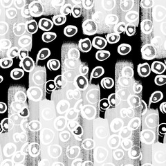 a black and white painted background with white abstract circles