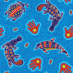 Australian aboriginal art seamless vector pattern with dolphin, turtle, platypus, palm and other dotted typical elements