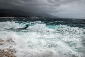 Stormy sea view  near coastline at evening time. Waves, splashed