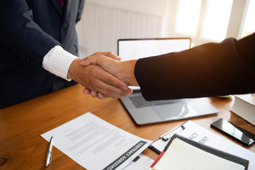 The lawyer shaking  hand agreement for consult preparing the phrase to be law for people who come to listen to counseling to receive social justice..concept of business