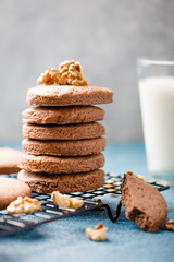 Pile of Delicious Chocolate Chip Cookies on a  board with Milk Bottles