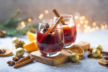 Christmas mulled wine delicious holiday like parties with orange cinnamon star anise spices. Traditional hot drink or beverage, festive cocktail at X-mas or New Year .