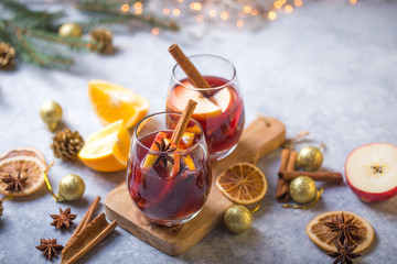 Christmas mulled wine delicious holiday like parties with orange cinnamon star anise spices. Traditional hot drink or beverage, festive cocktail at X-mas or New Year .