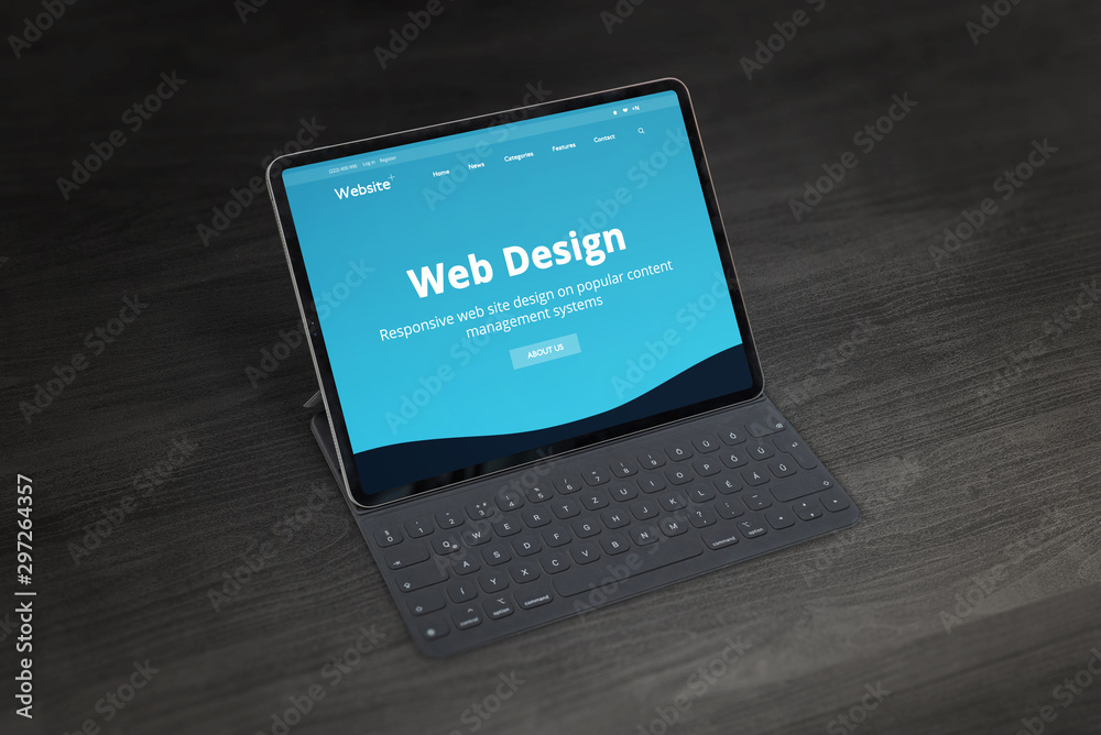 Poster Web design studio promo web site on tablet with keyboard on office desk. Responsive web design promotion concept.