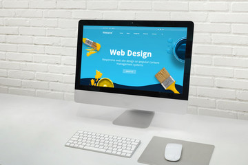 Web design studio concept with modern computer display with web design web site theme concept.
