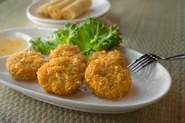 Deep-fried breaded shrimp cakes served with plum sauce