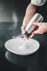 Professional chef making food in restaurant 