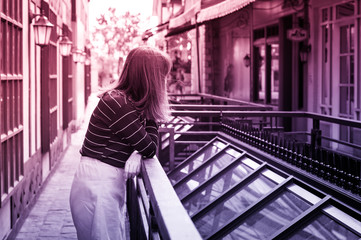Female waiting or seeing some things, multi color filtered.