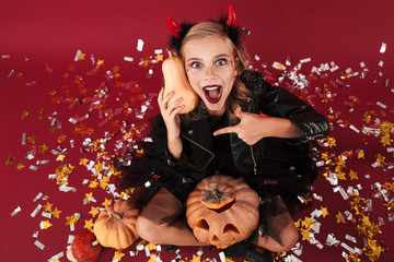 Obraz na płótnie Canvas Girl devil in carnival halloween costume