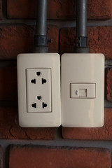 Outlet socket or mains receptacle plug panel on  wall.