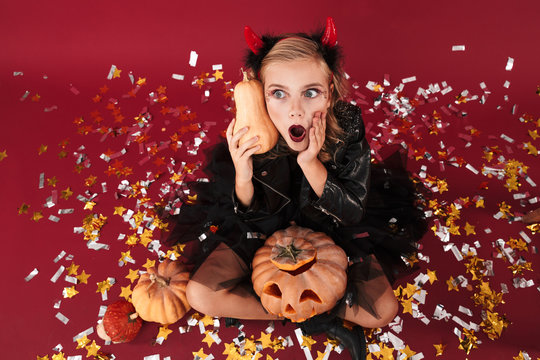 Girl devil in carnival halloween costume