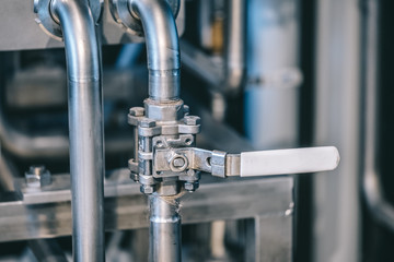 Craft beer brewing equipment in brewery! Metal tanks, alcoholic drink production