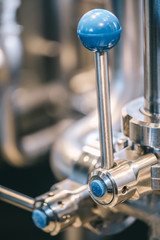 Craft beer brewing equipment in brewery! Metal tanks, alcoholic drink production