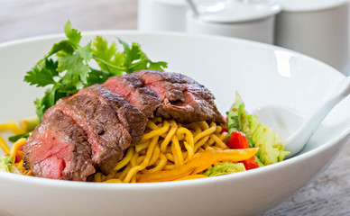 noodles with beef and vegetable bowl