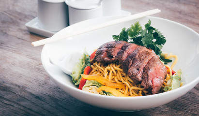 noodles with beef and vegetable bowl