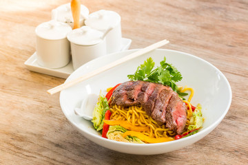 noodles with beef and vegetable bowl