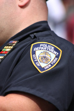 New York City Police Department shield  on a police officer's shirt