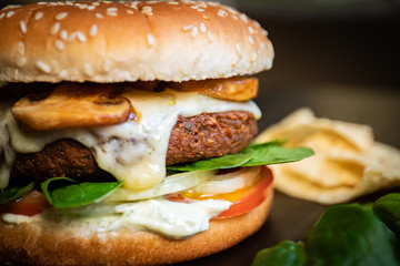 Delicious vegan falafel burger, cheese made from cassava and mushrooms. Healthy veggie vegetarian sandwich with no animal derivatives.