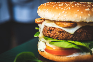 Delicious vegan falafel burger, cheese made from cassava and mushrooms. Healthy veggie vegetarian sandwich with no animal derivatives.