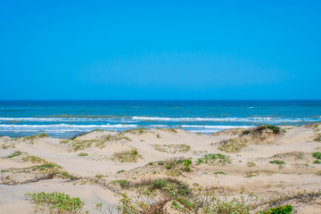 A beautiful soft and fine sandy beach along the gulf coast of South Padre Island, Texas