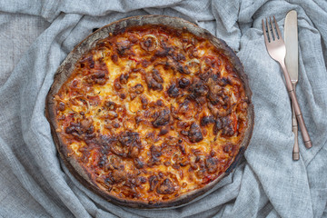 Hot tasty delicious rustic homemade pizza with tomato and cheese, close up, top view