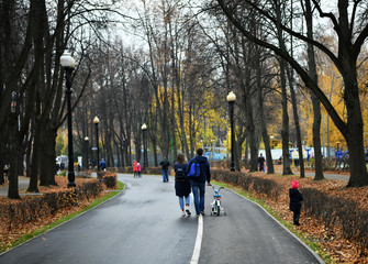 couple of young people walks in the park