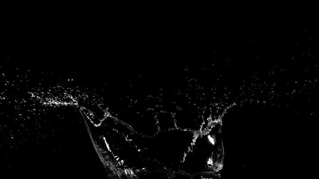 Super slow motion of splashing water isolated on black background. Filmed on very high speed cinema camera, 1000 fps.