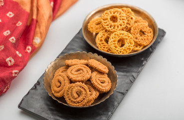 Obraz na płótnie Canvas Diwali Snacks or Diwali sweets, like chakli, sev, bhujiya, shakar pare or favourite indian diwali recipe