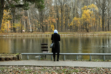 girl in black by the lake