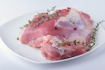 Turkey thigh with herbs, spices closeup