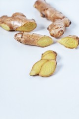 Top view of fresh ginger root sliced on white background.Healthy food and detox concept.Medical Products and Nutrition Ingredients.Сopy space for text.
