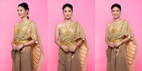 Golden Dress of Thai Traditional Costume or South East Asia gold Dress in Asian Woman with...