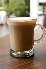 Hot coffee on a wooden table