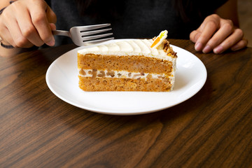 Carrots, cream cheese cake on the table