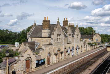 Fototapeta na wymiar Architectural; view of a very old British railway station, built during the steam era, now partially restored as a heritage railway area.