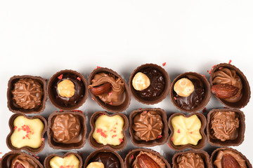Mix of tasty chocolate candy collection isolated on white. Copy space.