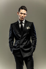 Obraz premium business, businessman, suit, young, fashion, handsome, portrait, isolated, standing, model, people, white, black, person, confident, guy, studio, shirt, tie, casual, happy, successful, men