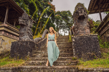 Woman tourist in abandoned and mysterious hotel in Bedugul. Indonesia, Bali Island. Bali Travel...