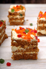 Sponge cake with honey and cream on wooden background