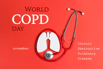 World COPD day concept with lung symbol and stethoscope on a red background.