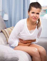 Brunette suffering from abdominal pain