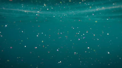 plastic pollution, micro nurdles and plastic particle in ocean water - obrazy, fototapety, plakaty