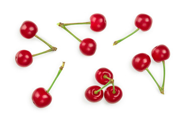 Obraz na płótnie Canvas Some cherries with leaf closeup isolated on white background. Top view. Flat lay.
