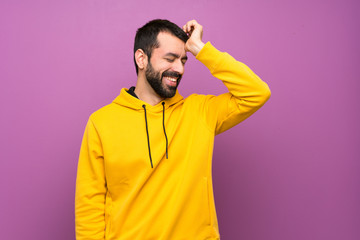 Handsome man with yellow sweatshirt has realized something and intending the solution