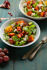 Tasty salad with avocado and baked pumpkin, healthy food
