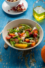 Salad with avocado and baked pumpkin, healthy food