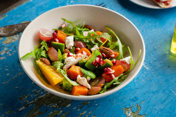 Salad with avocado and baked pumpkin