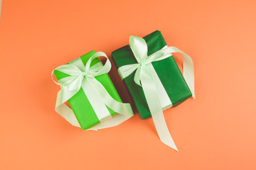Present with a bow on orange background