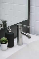 Bathroom interior with sink and faucet.